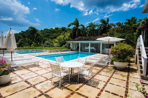A backyard with a pool surrounded by foliage in Montego Bay, Jamaica